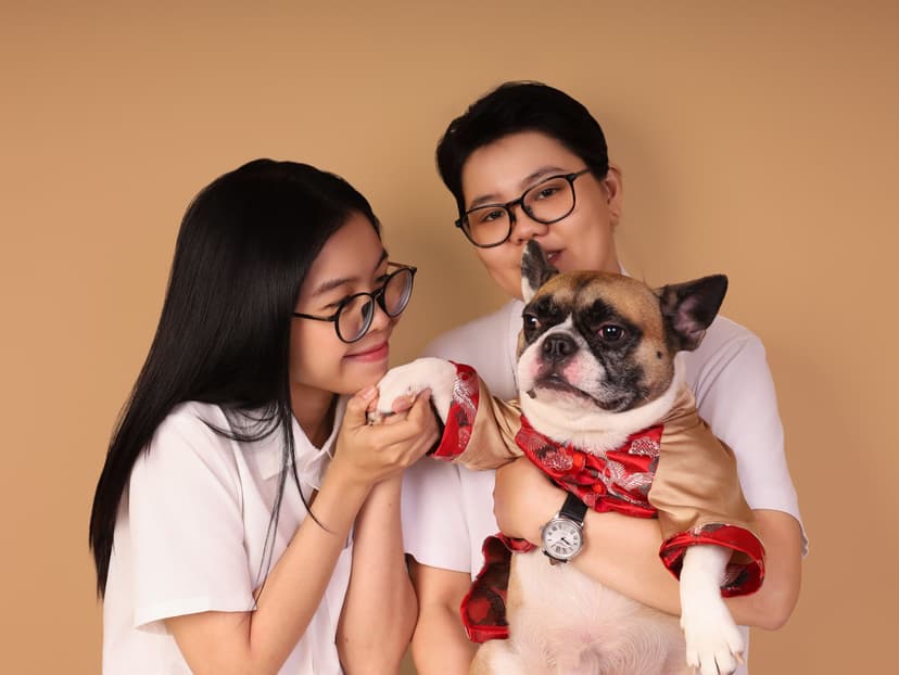 The family posing with their dog at Petcial.